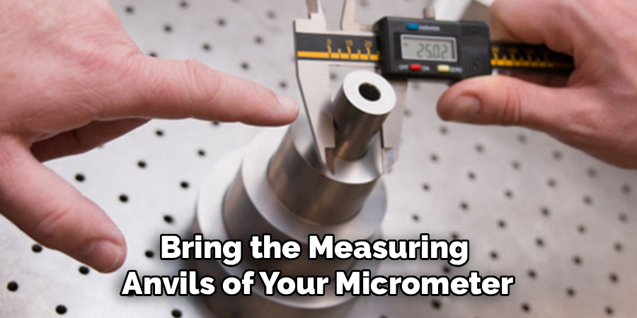 Bring the Measuring
Anvils of Your Micrometer
