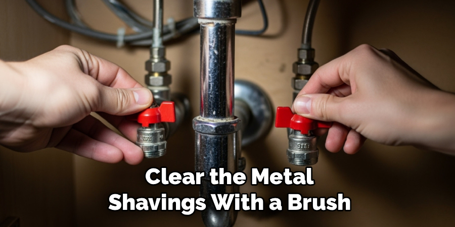 Clear the Metal
Shavings With a Brush