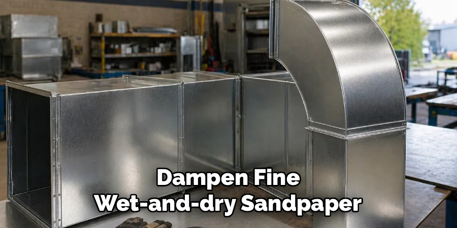 Dampen Fine 
Wet-and-dry Sandpaper