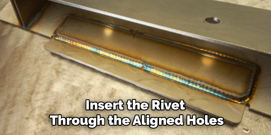 Insert the Rivet
Through the Aligned Holes
