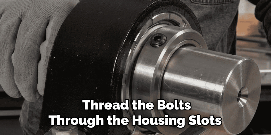 Thread the Bolts
Through the Housing Slots