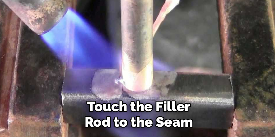  Touch the Filler 
Rod to the Seam
