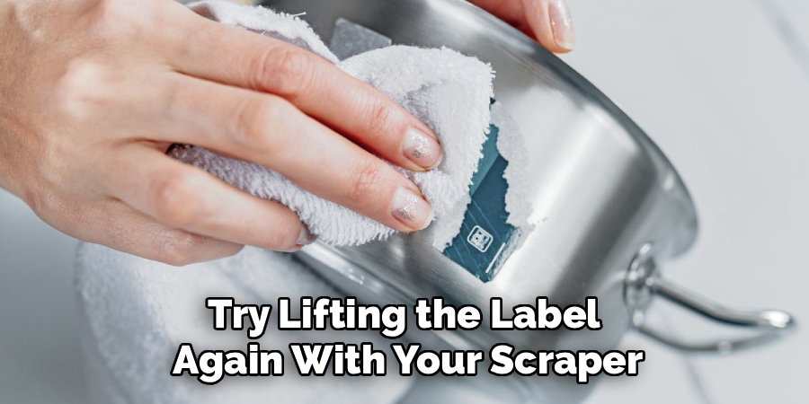 Try Lifting the Label 
Again With Your Scraper