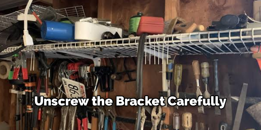 Unscrew the Bracket Carefully
