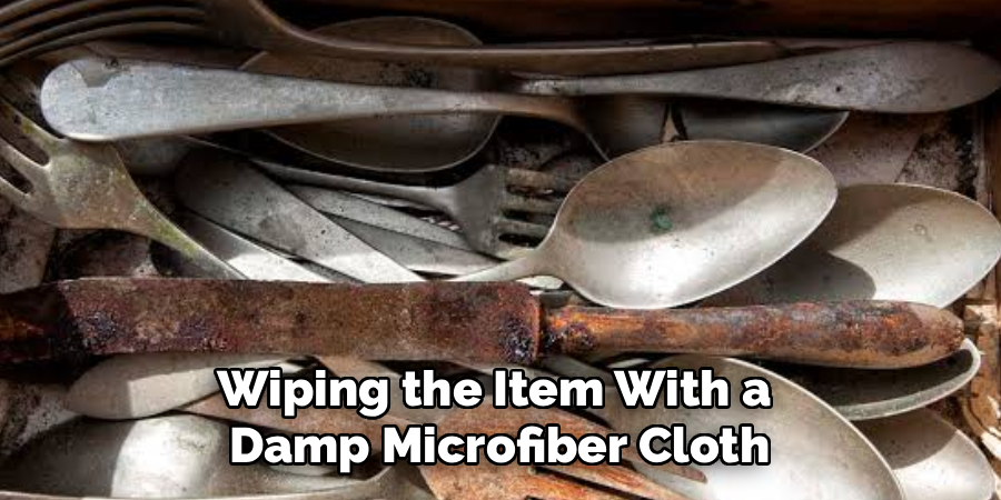 Wiping the Item With a
Damp Microfiber Cloth